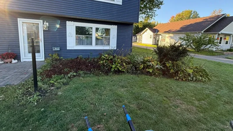 Outdated front garden bed before landscaping renovation in Northeast Ohio