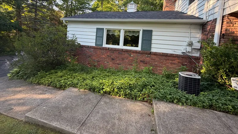Garden beds before fresh mulch installation in Northeast Ohio
