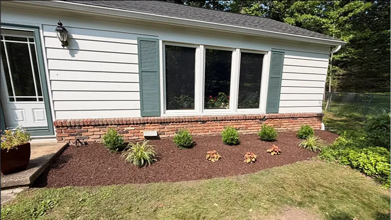 Finished residential landscape makeover with updated garden beds and plantings