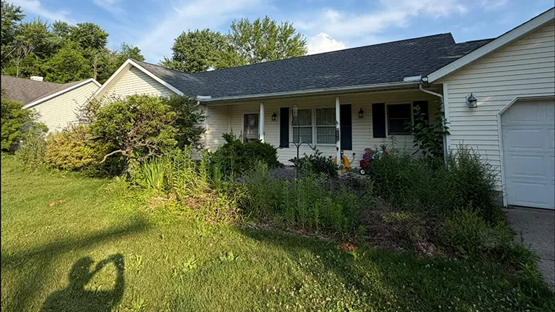 Front yard before professional landscaping improvements in Painesville Ohio